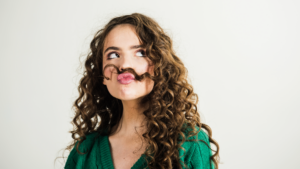 Brunette girl with long and shiny curly hair